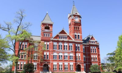 Historic red-brick university building with clock tower