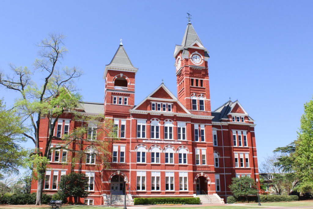 Historic red-brick university building with clock tower