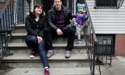 Family sitting on outdoor apartment steps