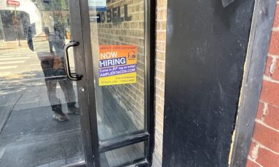 Now Hiring sign on Taco Bell door