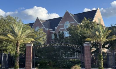 Florida State University entrance with brick building and palms