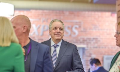 Man in suit at indoor business event