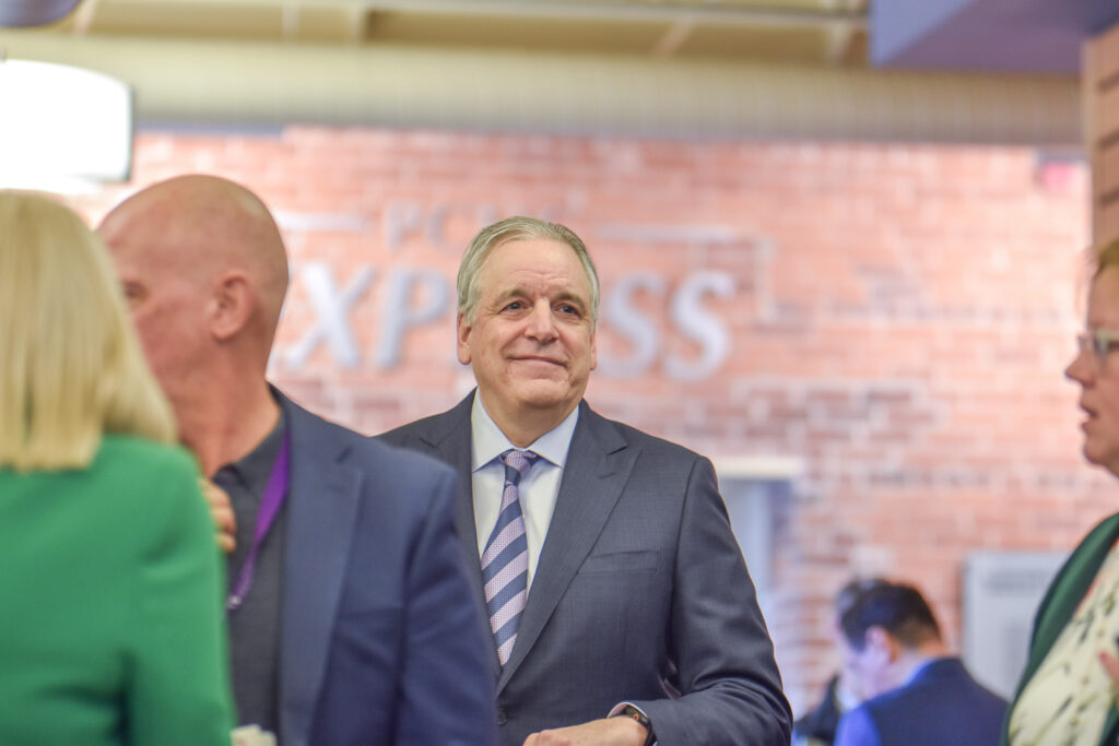 Man in suit at indoor business event