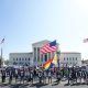 Protesters outside Supreme Court holding citizenship signs
