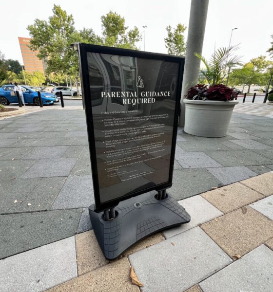 Parental guidance required sign on sidewalk — summer teen curfews