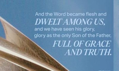 Open Bible pages with the verse John 1:14 highlighted, emphasizing the incarnation of Jesus Christ.