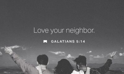 Three people with their backs to the camera, embracing and looking at a scenic landscape, with th — Galatians 5 14 meaning
