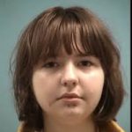 Portrait of young woman with brown bob haircut