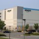 Amazon warehouse exterior with clear sky and parking lot, highlighting the company's logi — FTC Amazon advertising lawsuit