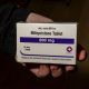 A hand holding a box of mifepristone tablets, labeled 200 mg, with instructions for patients. — mifepristone lawsuit texas