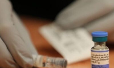 A healthcare worker prepares a measles, mumps, and rubella vaccine vial on a table. — Pennsylvania measles deaths