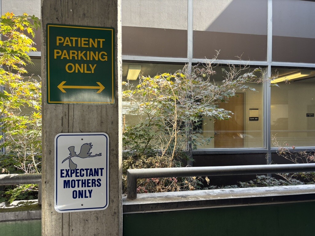 Signage indicating patient parking and expectant mothers only at a medical fac — High Risk Pregnancy Doctors Abortion Bans