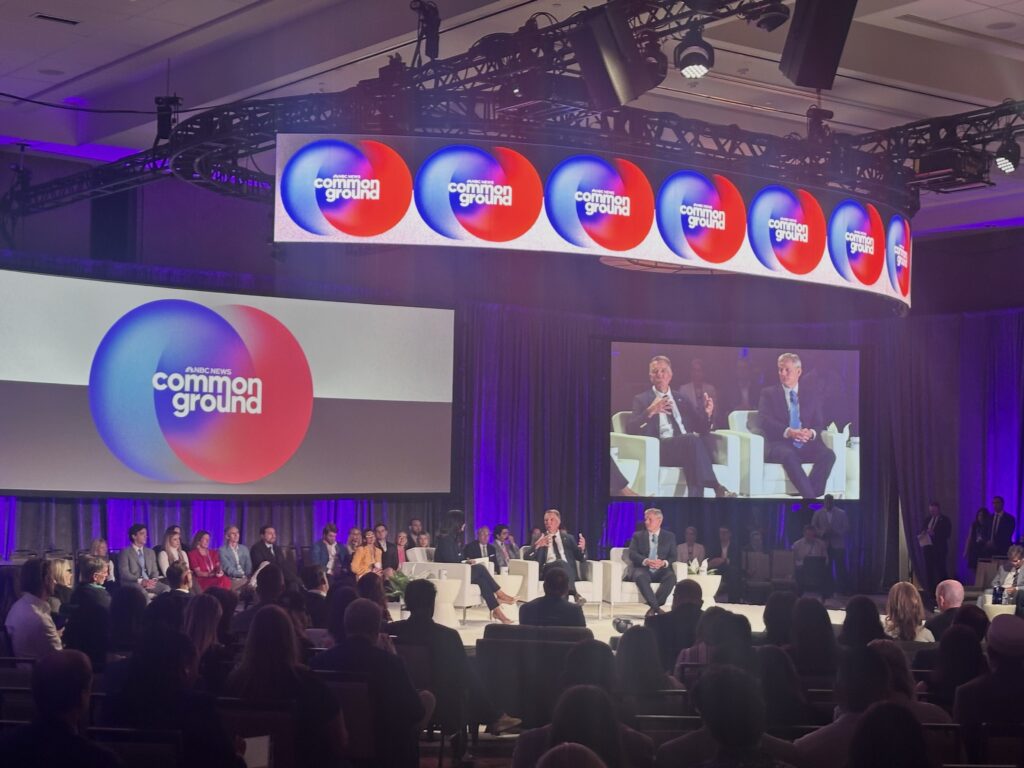Panel discussion featuring governors on stage addressing federal overreach, with a co — governors oppose federal overreach