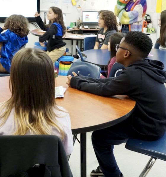 Students attentively listening in a classroom during a lesson on edu — department of education school monitoring suspended
