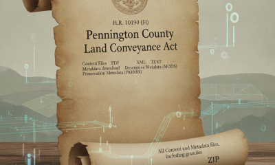Scroll with text detailing the Pennington County Land Conveyance Act and digital elements in the background.
