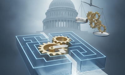 A conceptual illustration of gears in a maze with a backdrop of the U.S. Capitol, representing HR 5185 Title 41 legislation.