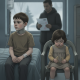 Two children in a hospital setting; one boy with a neck bandage and IV, and a gi — immigration enforcement children health