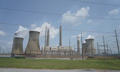 Coal and natural gas power plant with cooling towers and smokestacks under a cloudy — Trump EPA power plant emissions rule