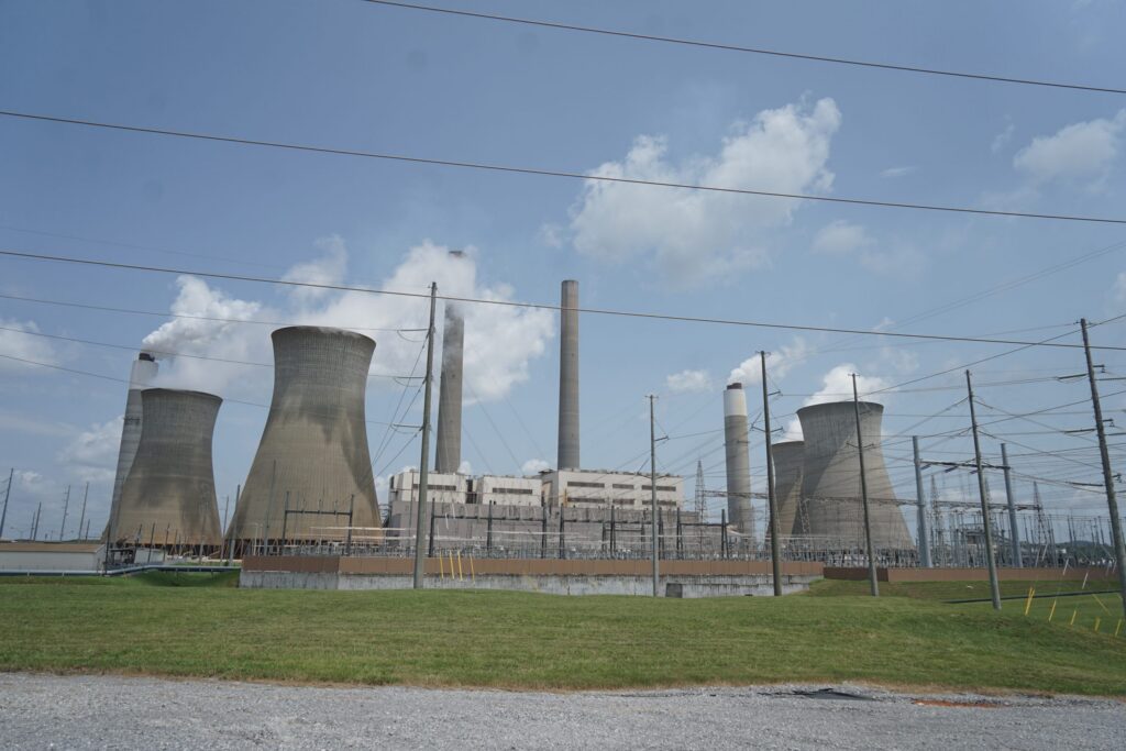 Coal and natural gas power plant with cooling towers and smokestacks under a cloudy — Trump EPA power plant emissions rule