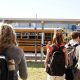 Students walking towards a yellow school bus, highlighting school safety and community. — school panic alarms