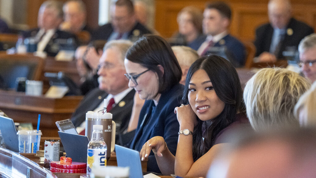 Young lawmakers in Kansas, including Angel Roeser, engage in a legislative session, highlighting Gen Z's involvement in po…