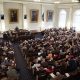 A crowded legislative chamber with numerous attendees and officials dur — state legislative elections competitive chambers