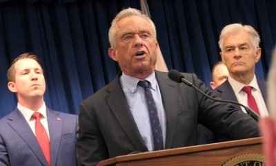 Robert F. Kennedy Jr. speaking at a podium with supporters in the background during a pr — FDA abortion pill safety review