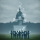 Silhouetted figures holding devices in front of the Capitol building, — National Cemetery Administration Annual Report Act