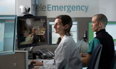 Healthcare professionals monitor a patient via telemedicine in a hospital setting, highlighting — US job growth September