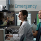 Healthcare professionals monitor a patient via telemedicine in a hospital setting, highlighting — US job growth September