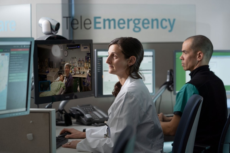 Healthcare professionals monitor a patient via telemedicine in a hospital setting, highlighting — US job growth September
